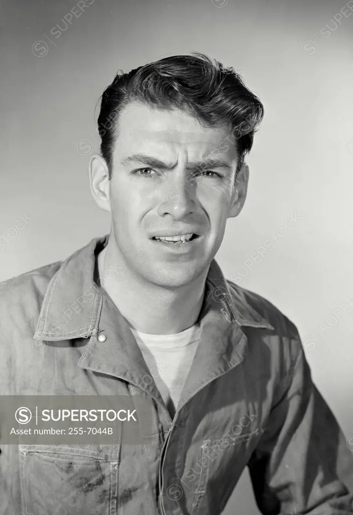 Vintage photograph. Man with confused expression looking slightly off camera