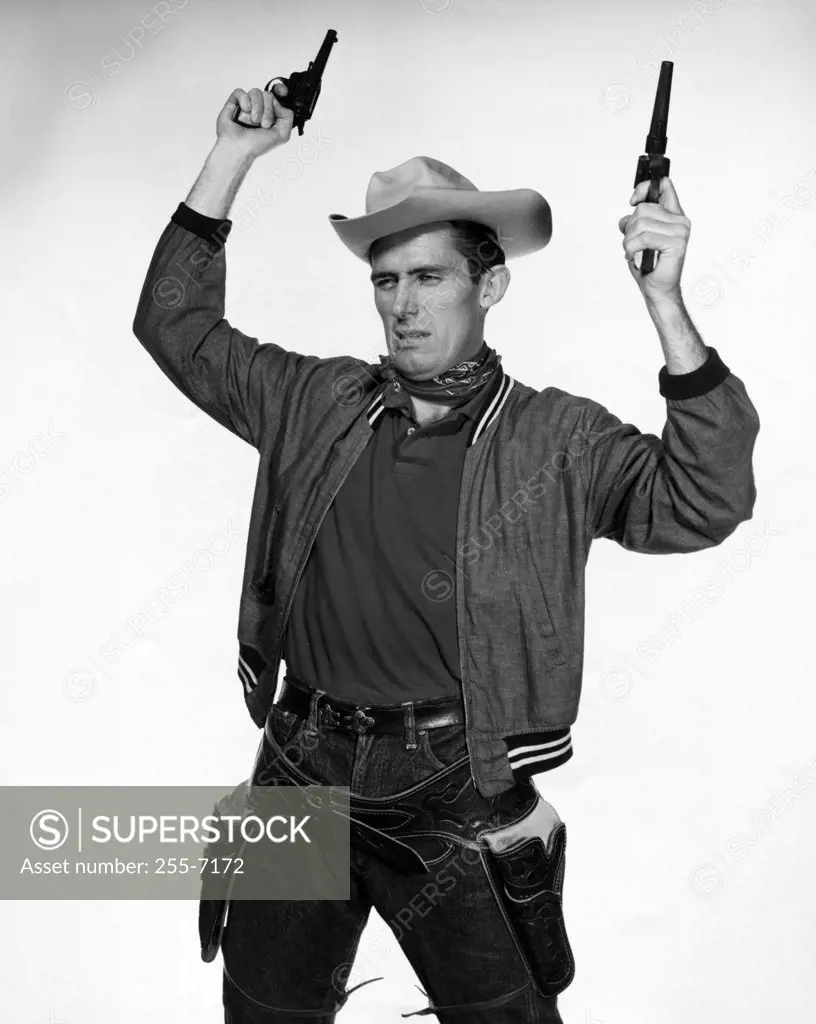 Cowboy holding two pistols