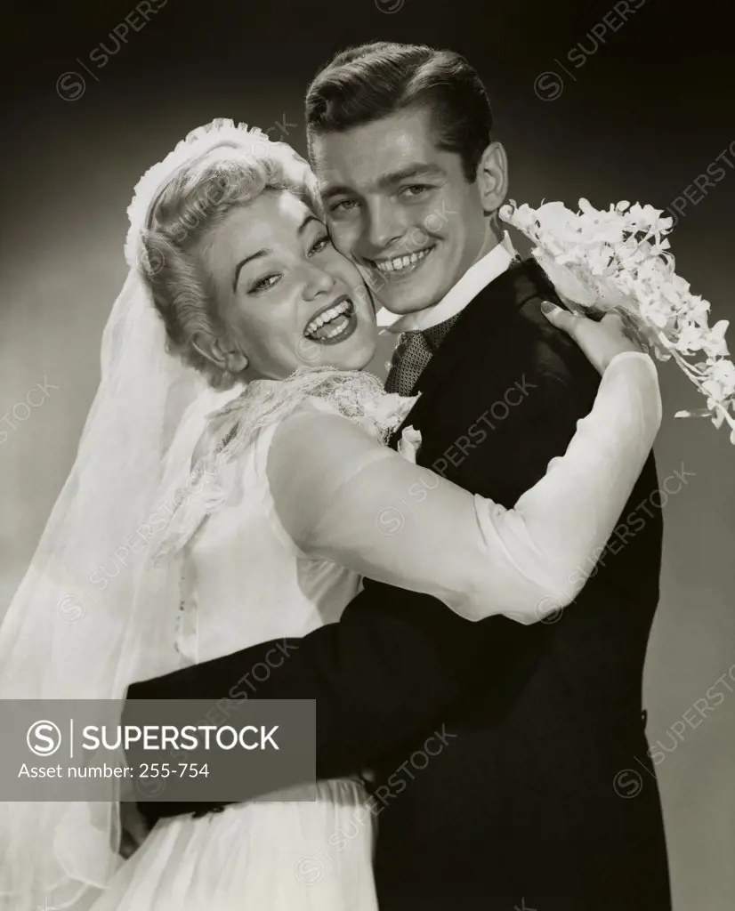 Portrait of a newlywed couple embracing