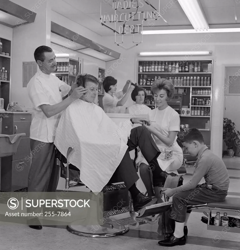 Mid adult man receiving beauty treatment in a hair salon