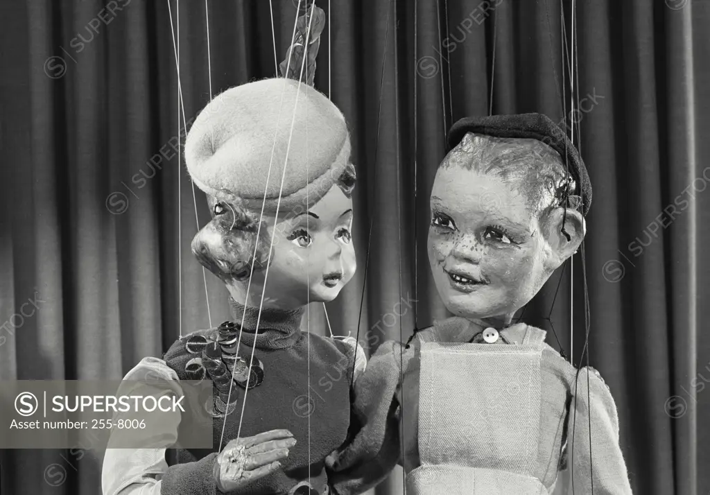 Vintage photograph. Male and female puppets having a conversation