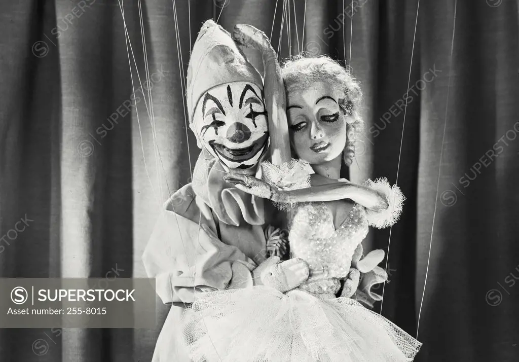 Vintage photograph. Clown and female marionette holding each other