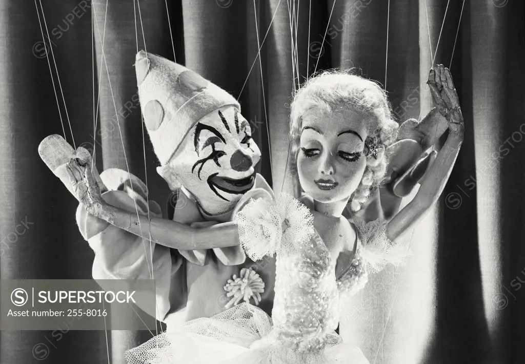 Vintage photograph. Clown and female marionette dancing