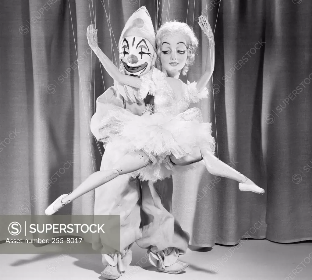 Two marionettes dancing