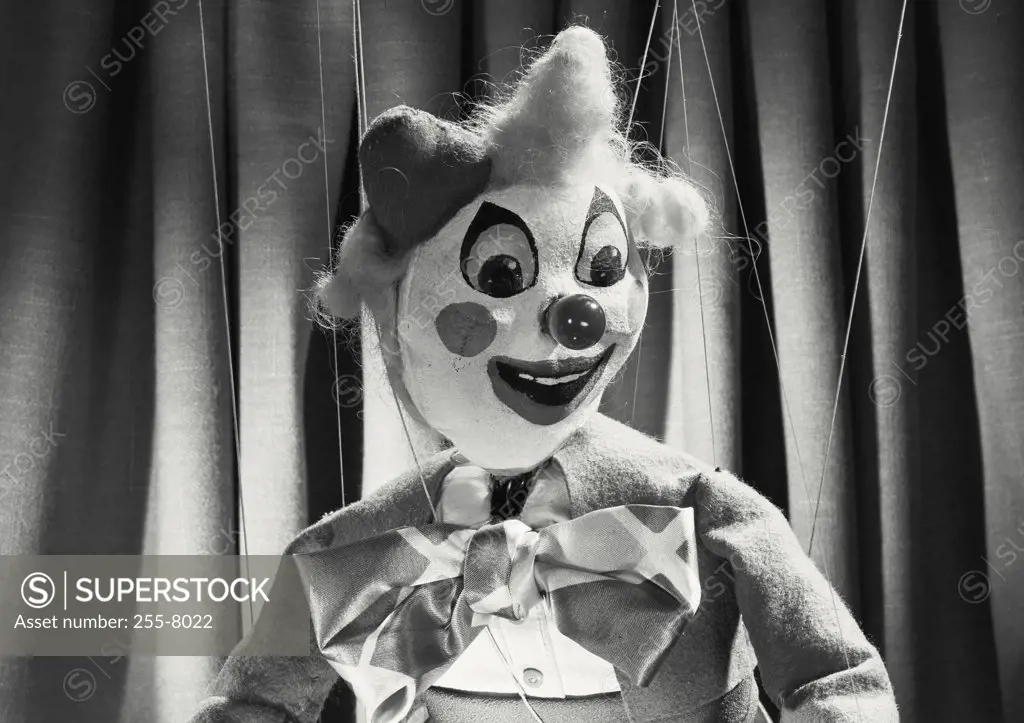 Vintage photograph. Clown marionette looking away