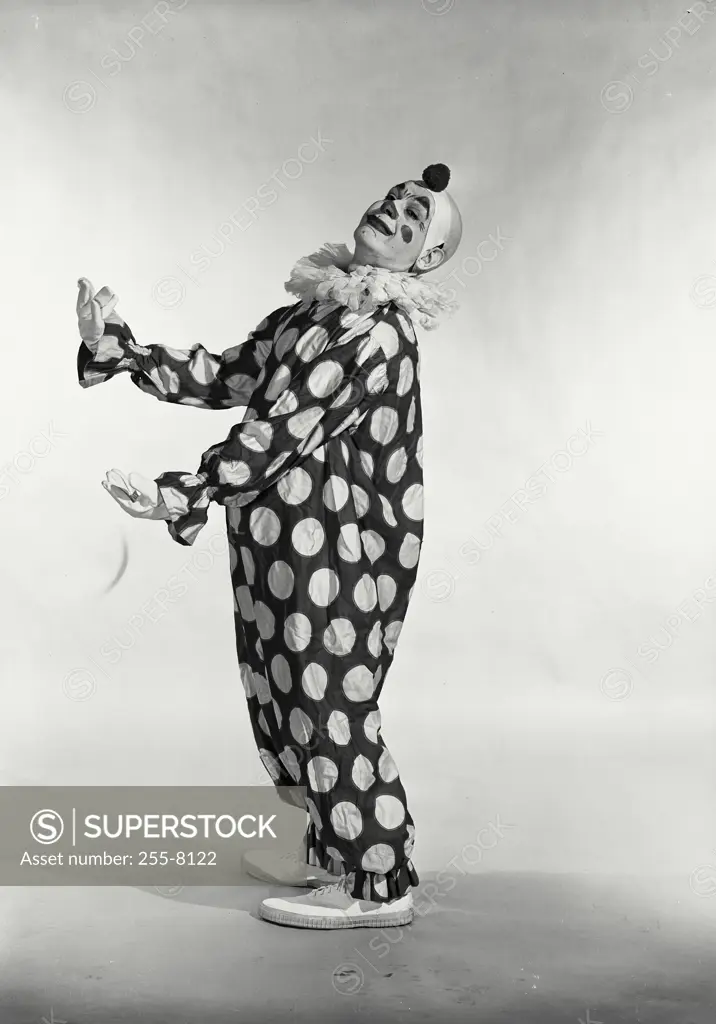 Vintage Photograph. Man in polka dot clown suit turned to side