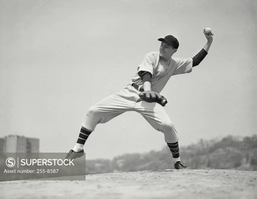 Side view of baseball pitcher during pitch