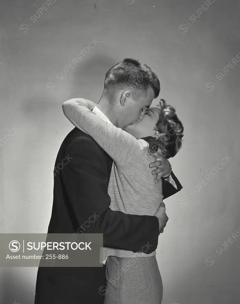 Vintage Photograph. Male female couple embracing and kissing