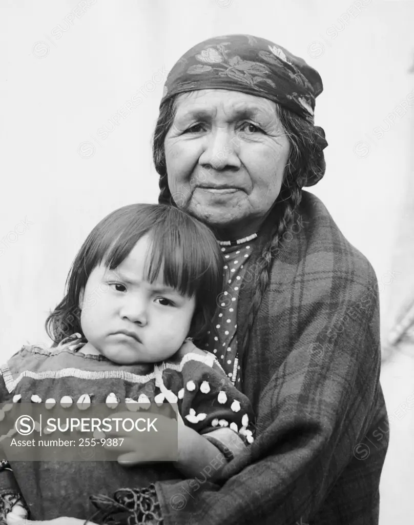 USA, Oregon, portrait of Umatilla woman sitting with granddaughter