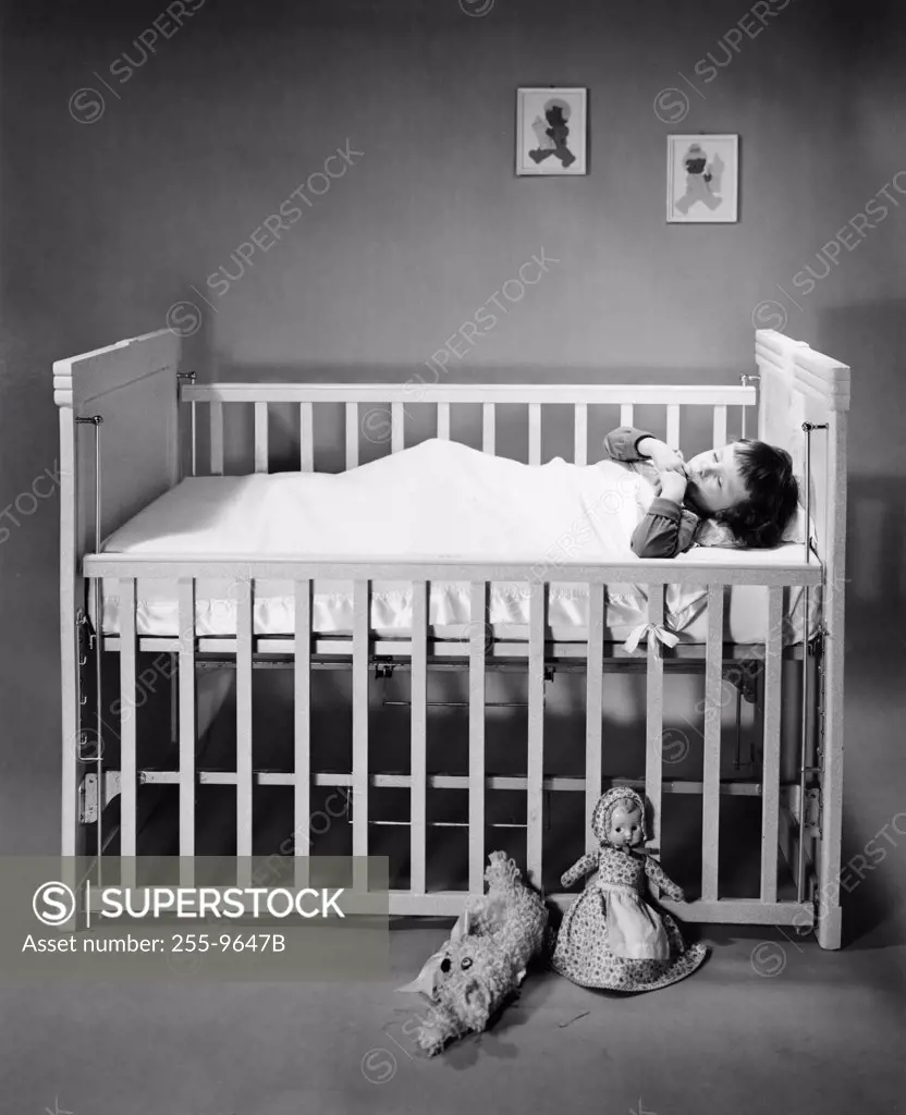 Boy sleeping in crib