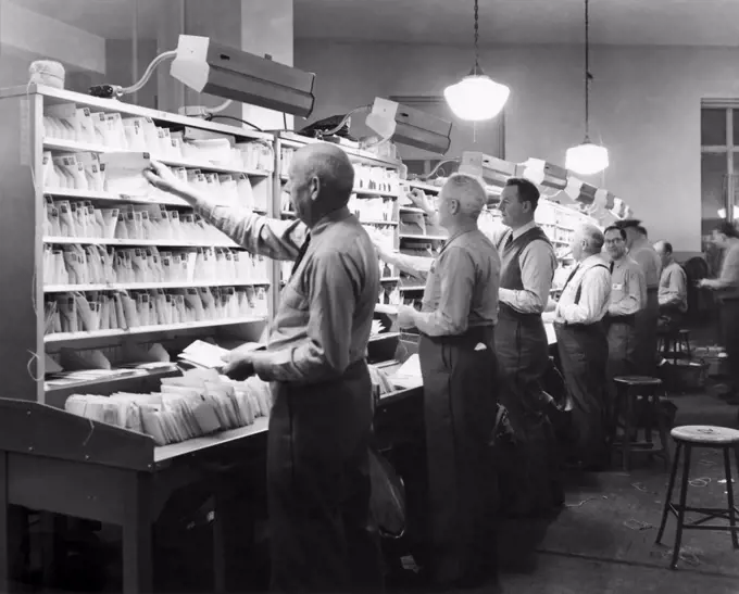 Postal workers sorting mails in a post office, Worchester, Massachusetts, USA