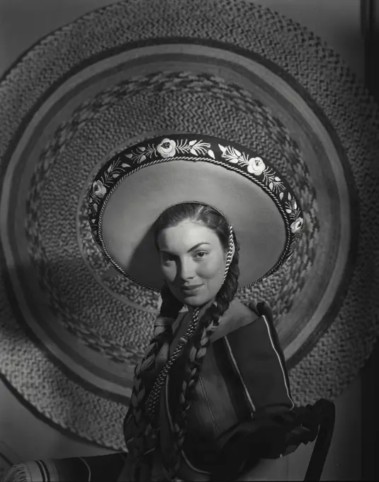 Vintage Photograph. Mexican woman wearing a large hat