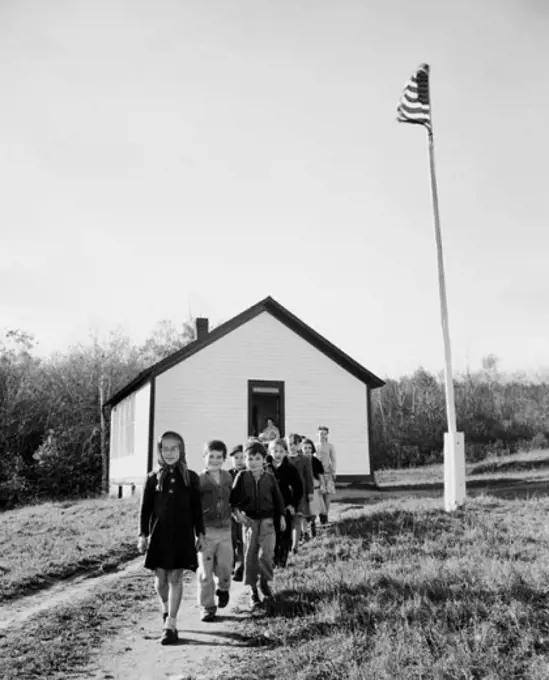 School children walking out of their school building, Massachusetts, USA