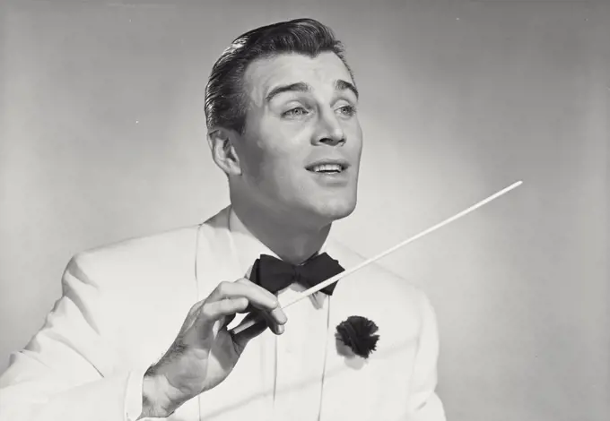 Vintage photograph. music conductor holding baton
