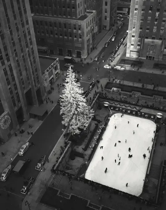 Vintage photograph. aerial view of Christmas tree scene and ice skating rink. Rockefeller Center