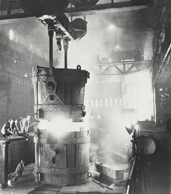 Vintage photograph. Pouring steel in a factory in Sheffield, England