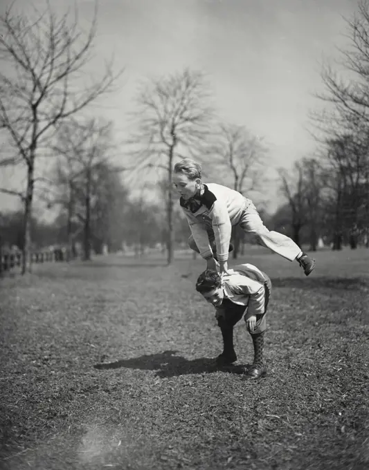 Vintage photograph. Boys playing leap frog