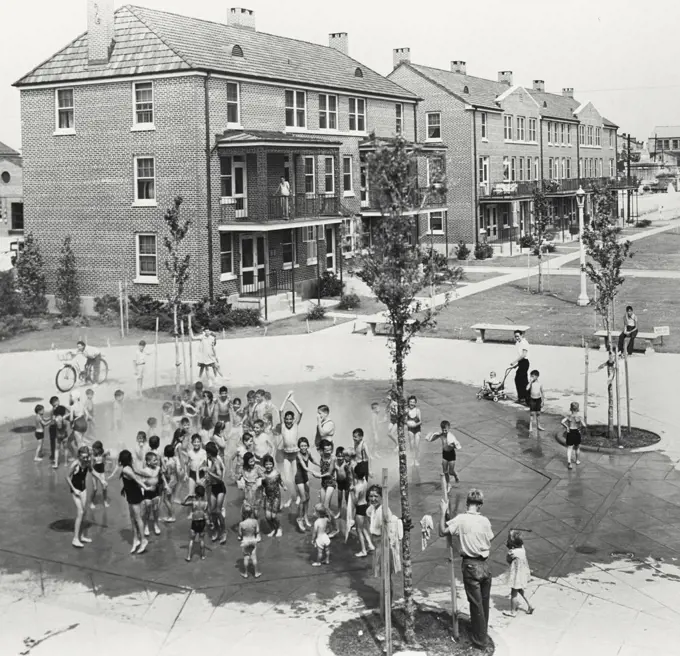 Vintage photograph. Children playing outside in fountain at Iberville Public Housing in New Orleans, Louisiana