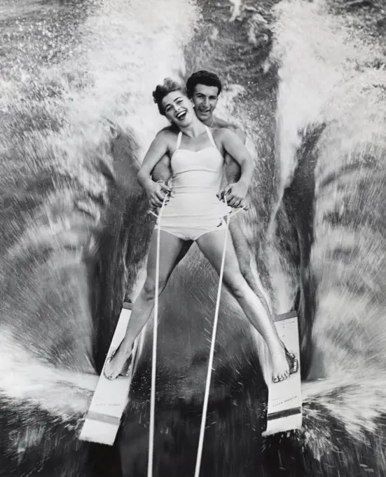 Portrait of a young couple waterskiing