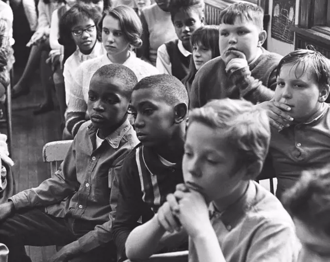 Schoolboys and schoolgirls in a classroom