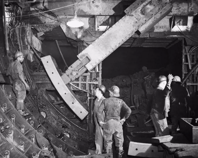 Five construction workers working in a subway tunnel, New York City, New York State, USA