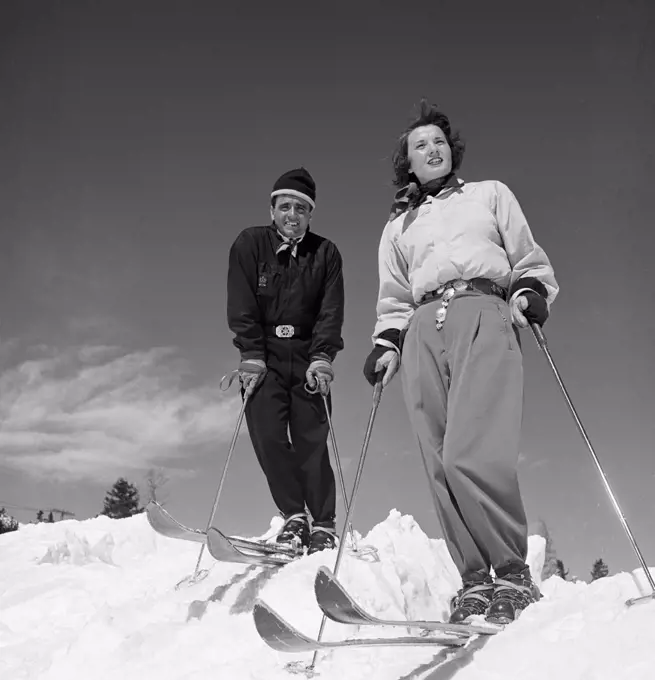 Portrait of couple skiing
