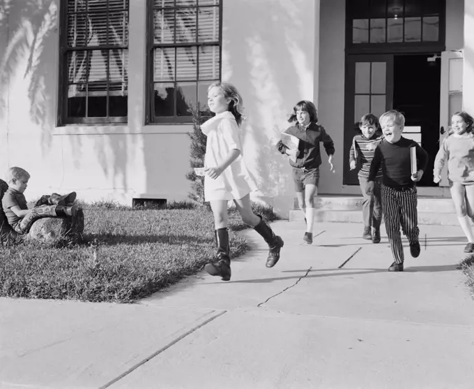 School children running around after school