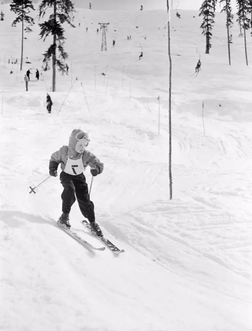 Boy skiing, high angle view