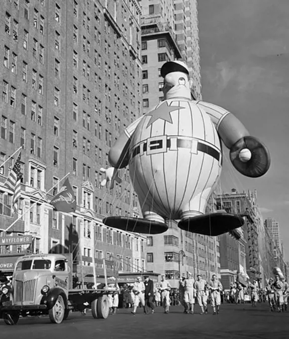 USA, New York State, New York City, Macy's Thanksgiving Day Parade holding baseball player balloon, 1946