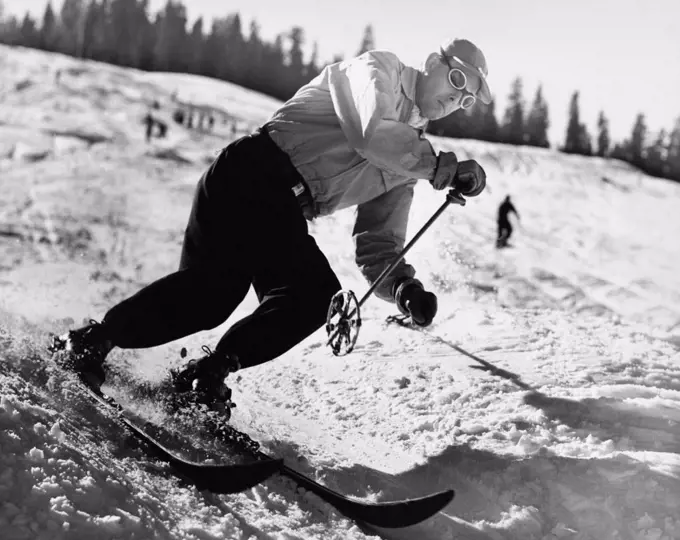 Mid adult man skiing downhill