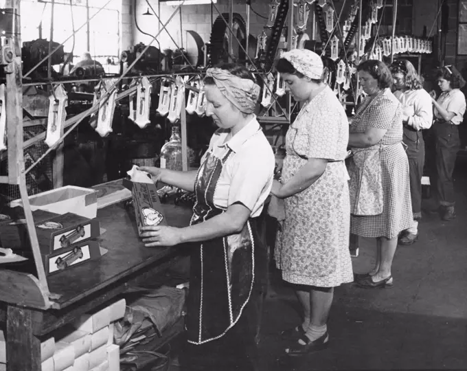 USA, Indiana, female workers working in toy car production line