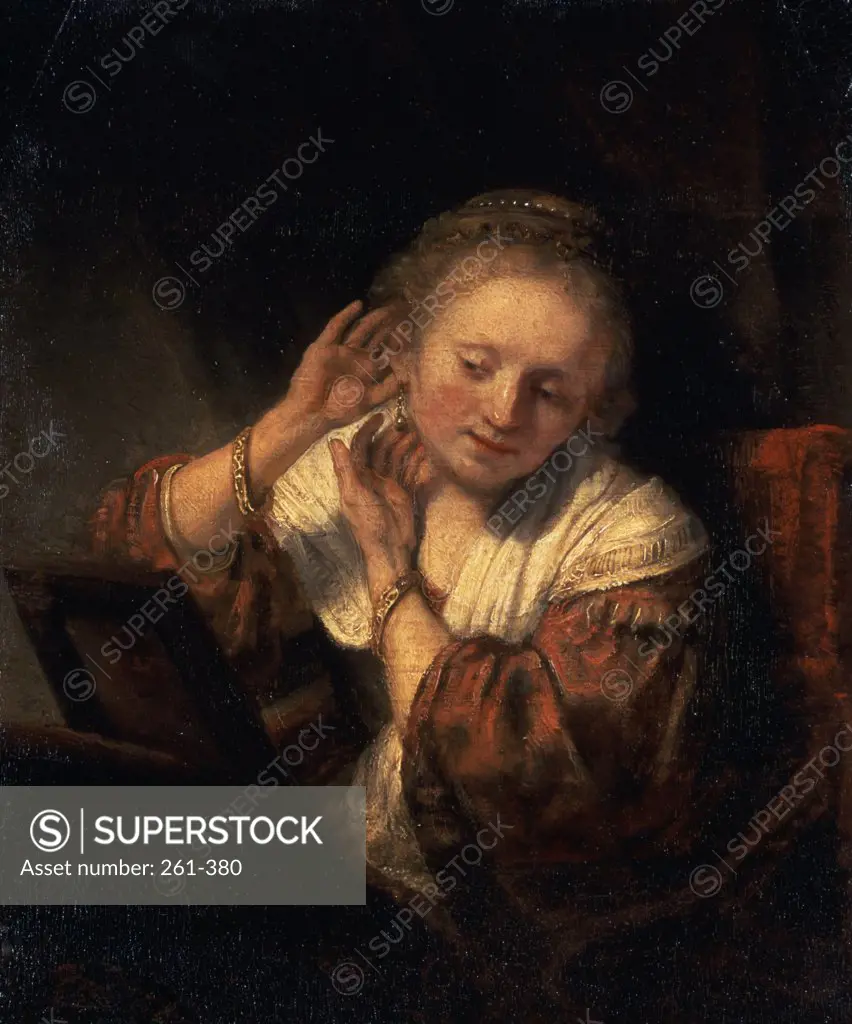 Young Woman Trying on Earrings Rembrandt Harmensz van Rijn (1606-1669 Dutch) Hermitage Museum, St. Petersburg, Russia