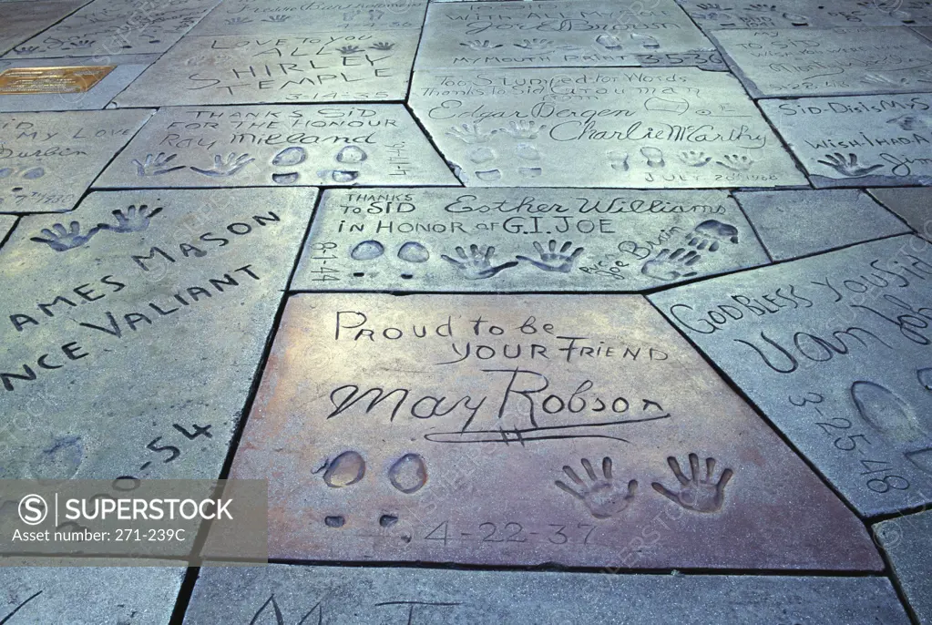 Close-up of text with handprint and footprints at a theater, Mann's Chinese Theater, Hollywood, City of Los Angeles, California, USA