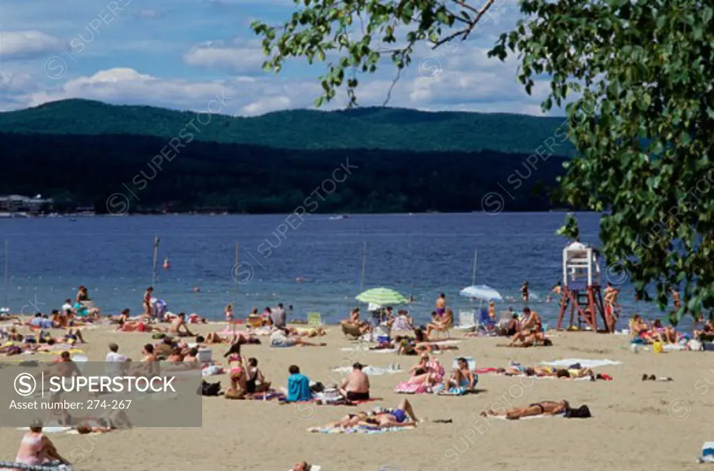 Tourists sunbathing on the beach, Public Beach, Lake George, New York, USA