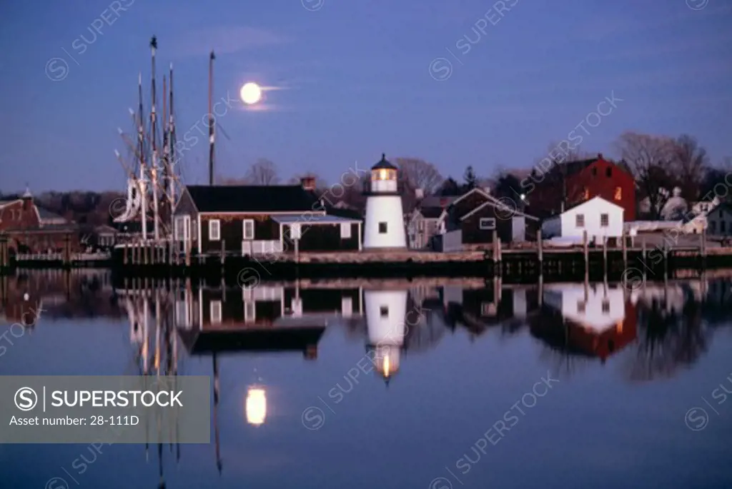 Reflection of buildings in a river, Mystic Seaport, Connecticut, USA