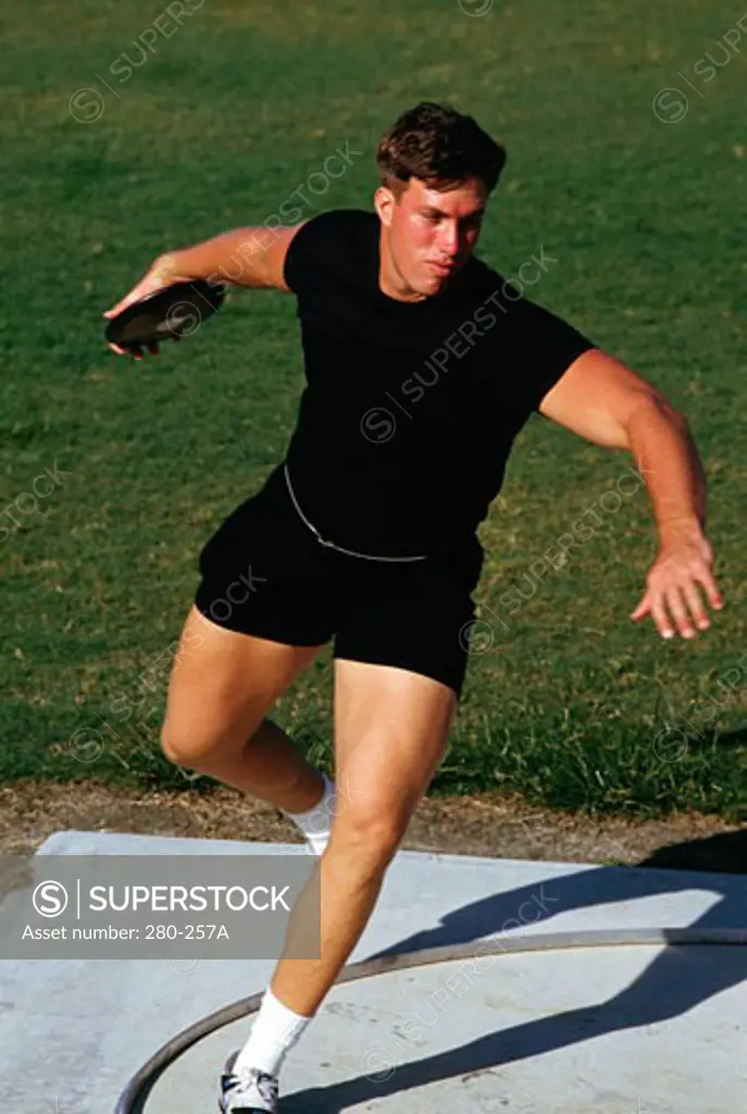 Young man preparing to throw a discus