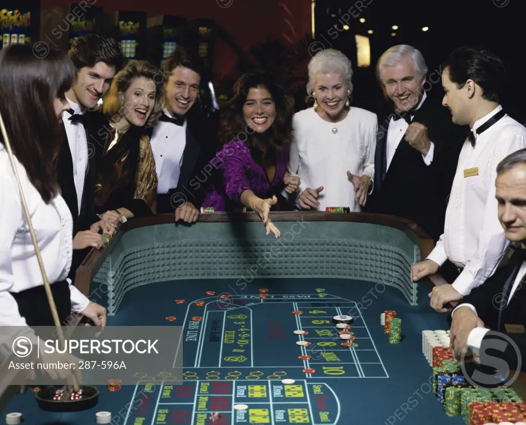 Group of people at a gambling table in a casino