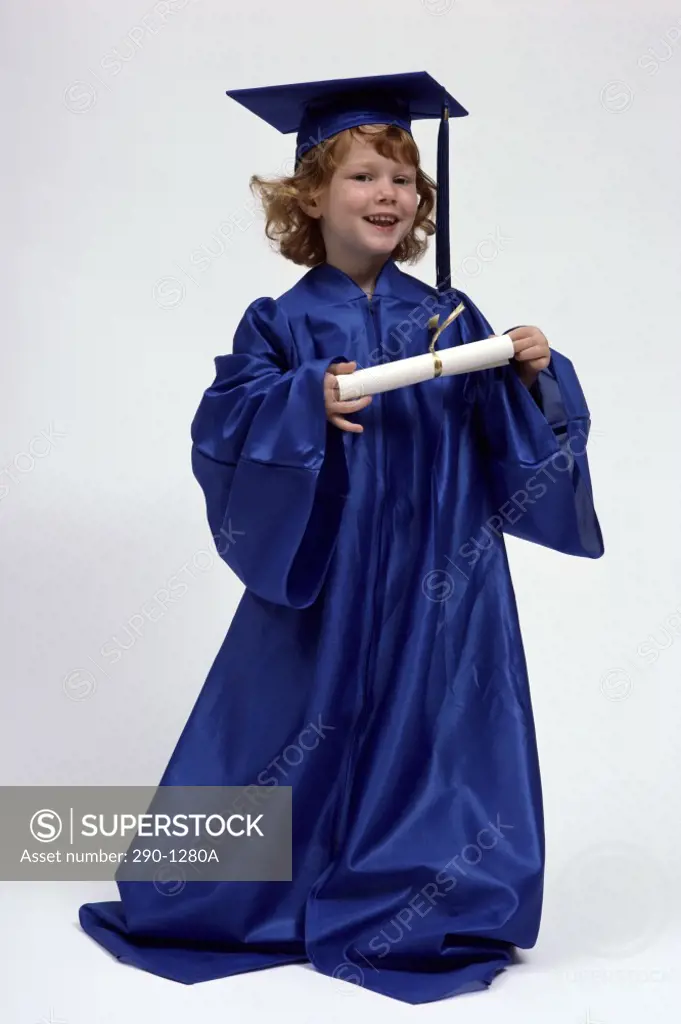Girl in a graduation gown holding a diploma
