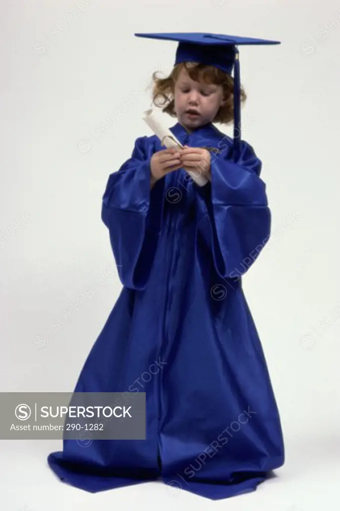 Girl in a graduation gown holding a diploma