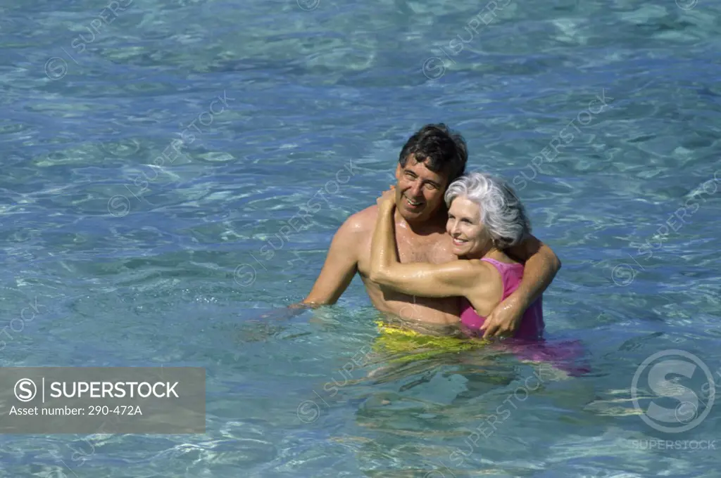High angle view of a senior couple in the sea