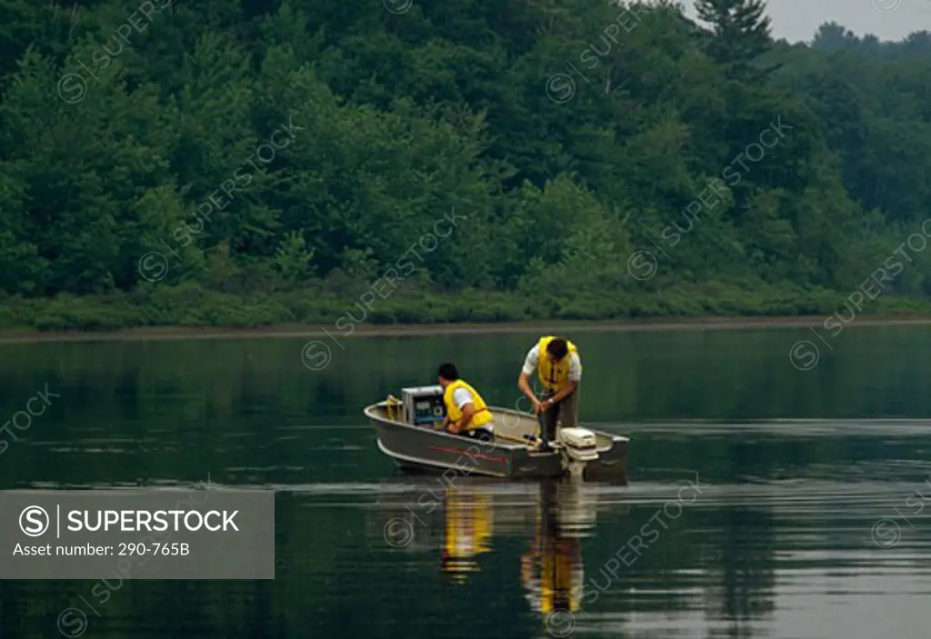 Scientists analyzing pollution level in a river, Chalk River Laboratories, Ottawa River, Canada