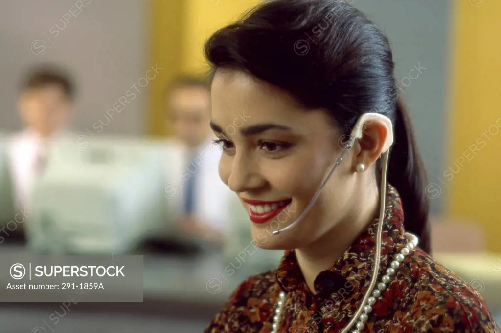Close-up of a businesswoman wearing a headset