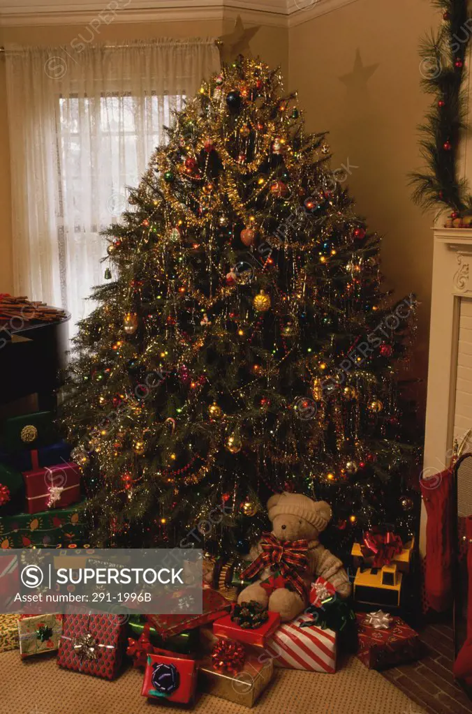 Christmas presents under a Christmas tree