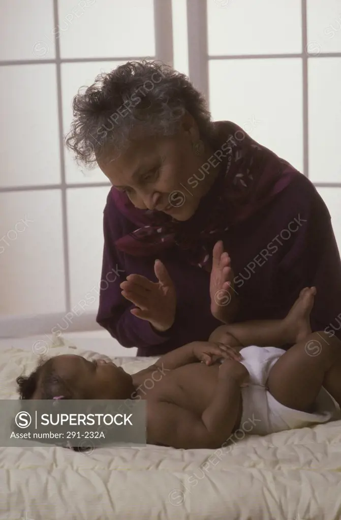 Senior woman singing a lullaby for her granddaughter