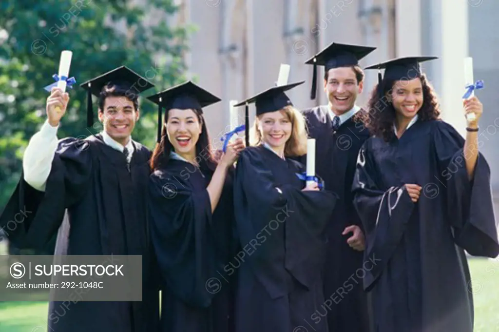 Portrait of a group of college students wearing graduation outfits