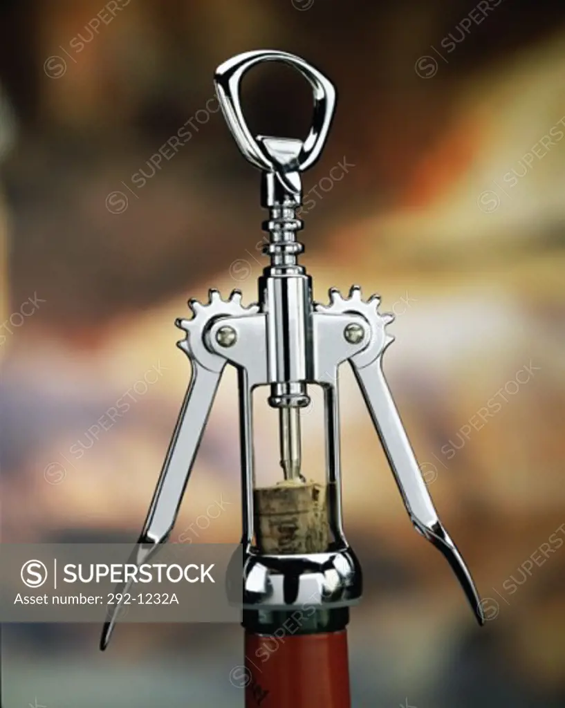 Close-up of a corkscrew on a wine bottle