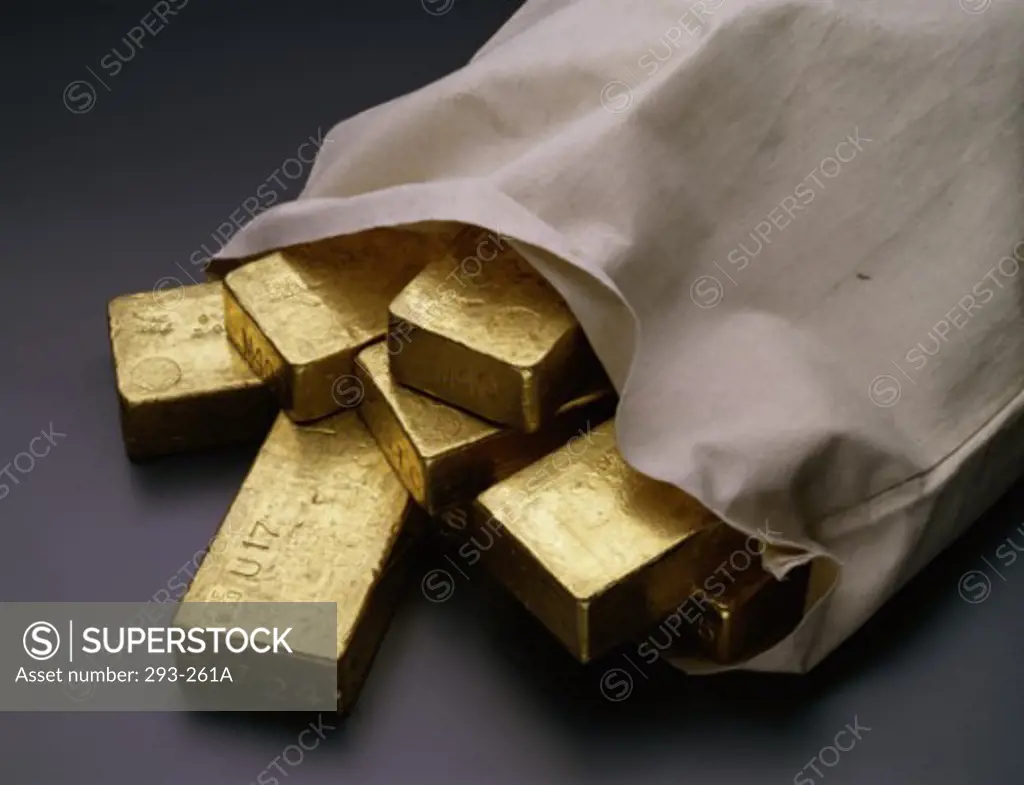 Close-up of gold bars in a bag