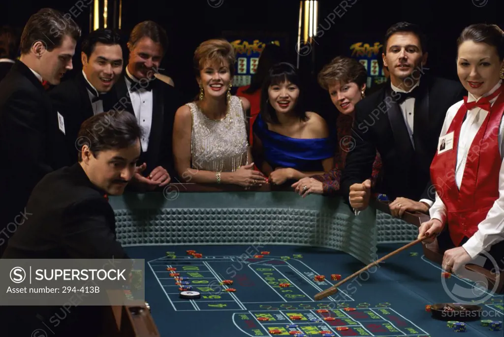 Group of people at a gambling table in a casino
