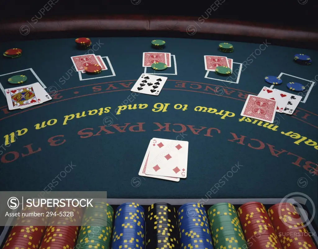 Playing cards with gambling chips on a blackjack table