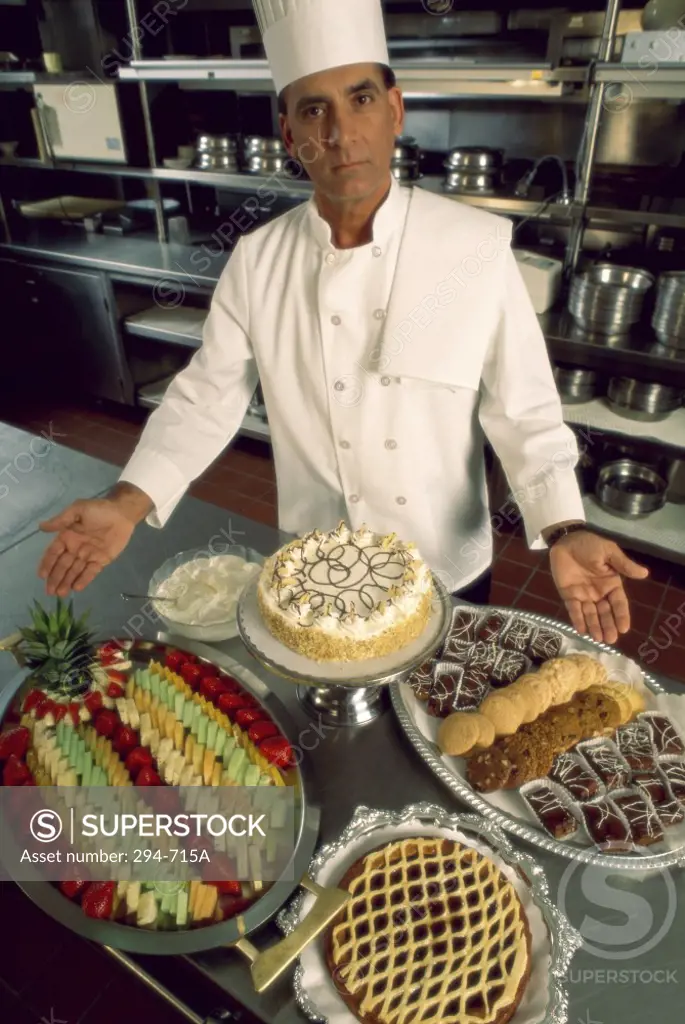 Chef standing in a kitchen and presenting food